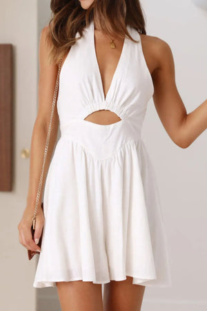 White cutout halter neck mini dress with tied, ruched, backless design, made of cotton-linen blend.
