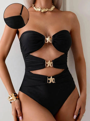 Black cutout sweetheart neck one-piece swimwear with gold shell accents and strapless design.